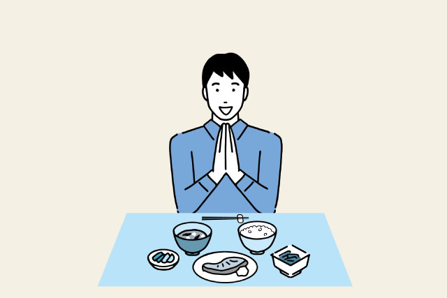 焼き鮭定食を前に笑顔でいただきますをする男性のイラスト